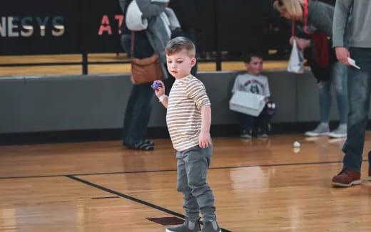 a boy holding a box