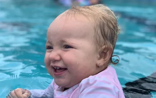 a baby in a pool