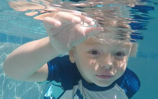 a boy in a pool