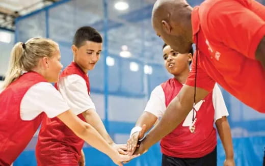 a group of people in red uniforms