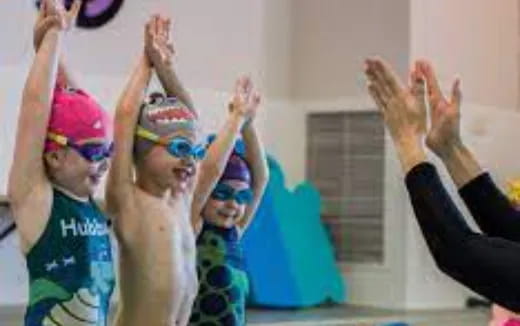 a group of people raising their hands