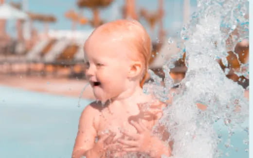a baby in a pool