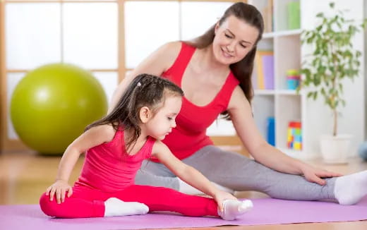 a woman and a child exercising
