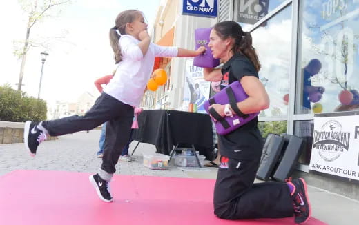 a woman lifting another woman