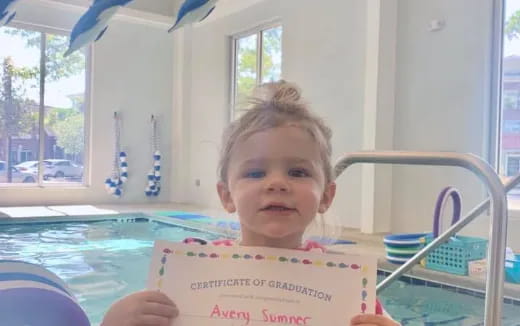 a child holding a sign