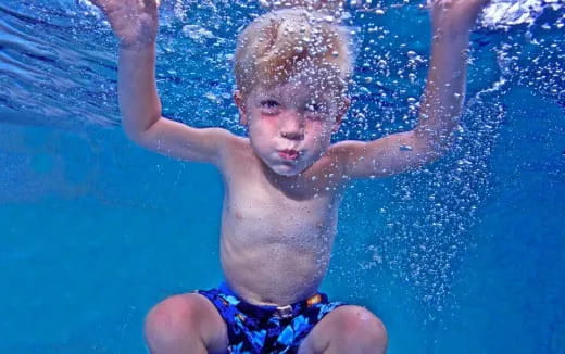 a boy in a pool