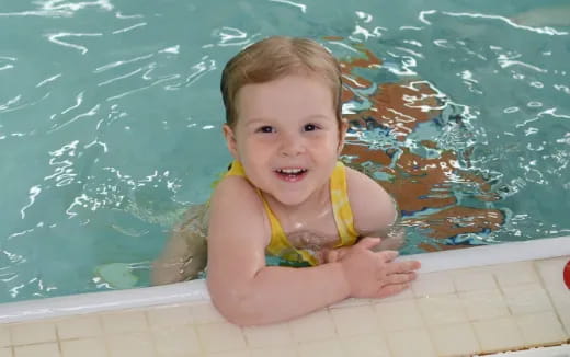 a baby in a pool