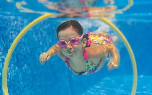 a baby in a pool