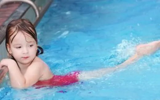a child in a pool