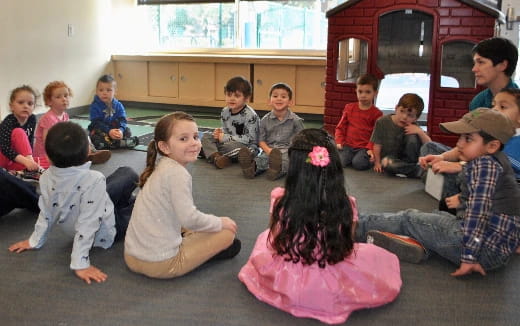 a group of children sitting on the floor