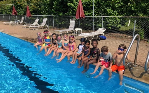 a group of kids in a pool