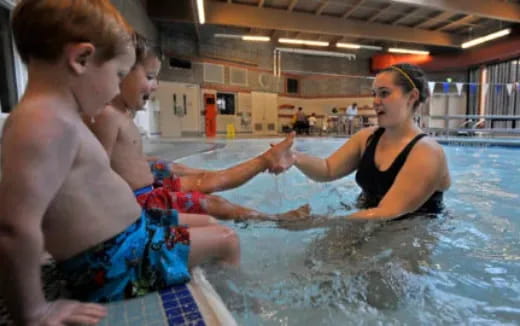 a man and a woman in a swimming pool