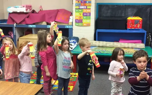 a group of children holding candy
