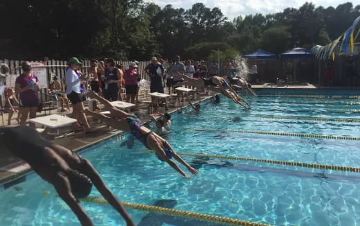 a group of people in a pool