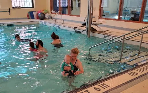 a group of people in a pool