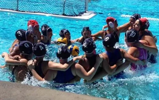 a group of people in a pool