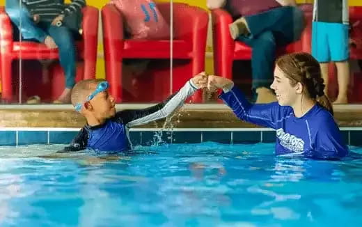 a man and a woman in a pool