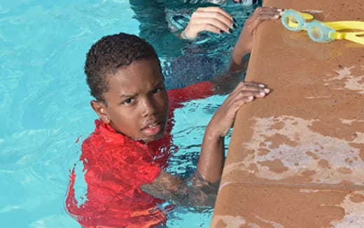 a boy in a pool