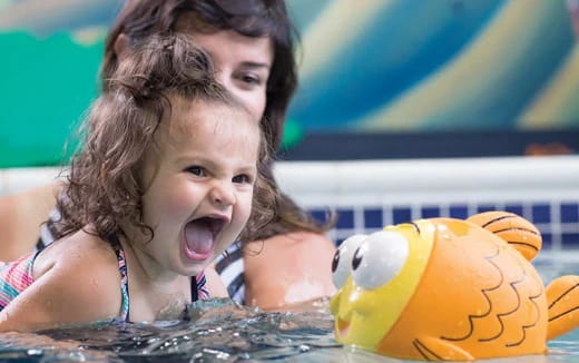 a baby in a pool