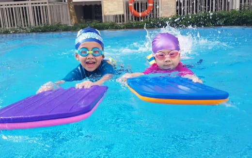 two kids in a pool