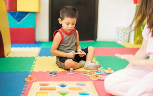 a baby playing with toys