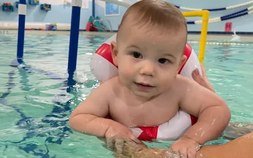 a baby in a pool