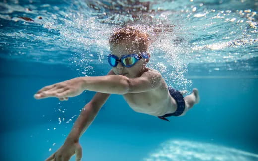a person swimming in a pool