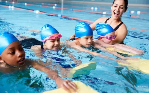 a group of people in a pool