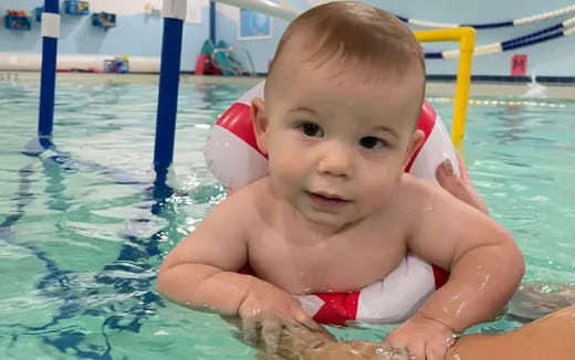 a baby in a pool