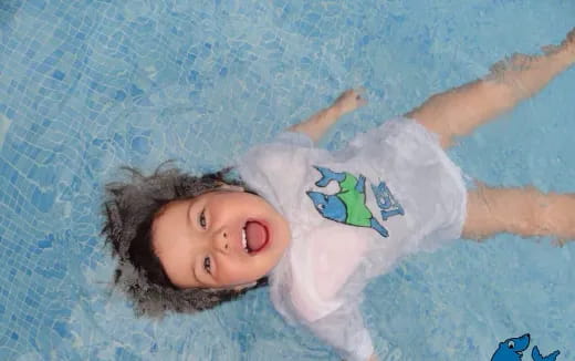 a child lying on a bed