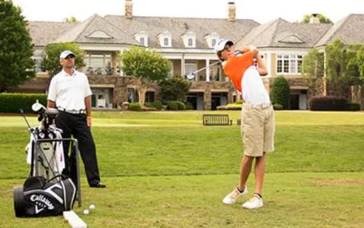 a couple of men playing golf