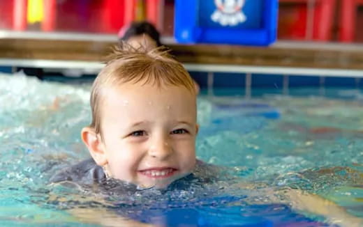 a boy in a pool