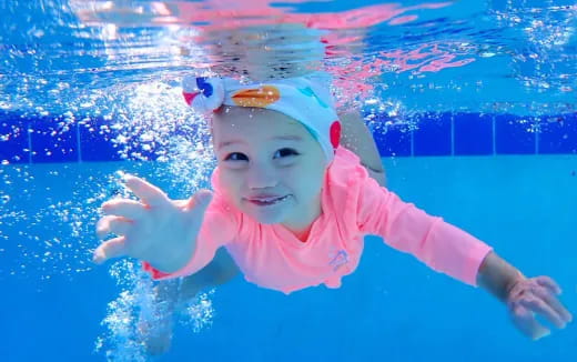 a baby in a pool