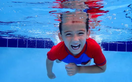 a boy in a pool