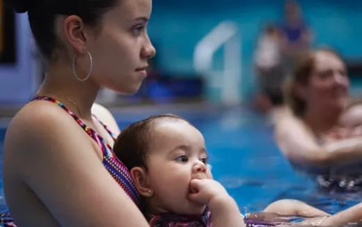 a woman holding a baby