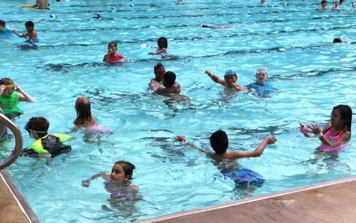 a group of people in a pool