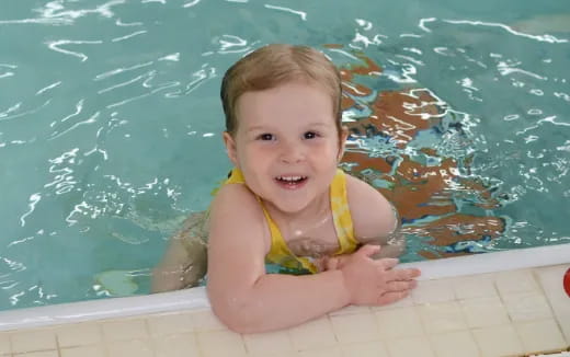 a baby in a pool