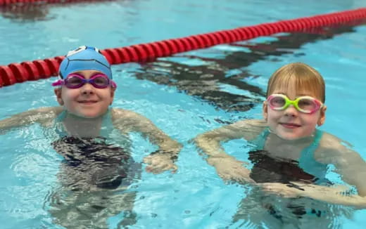 two kids in a pool