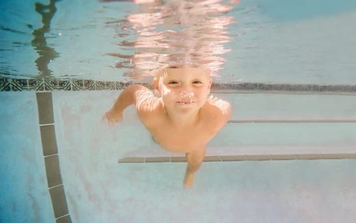 a baby in a pool