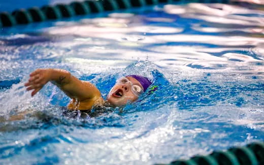 a person swimming in a pool