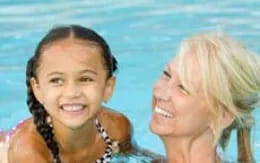 a couple of women smiling