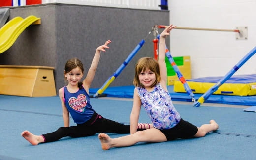 a couple of girls doing yoga