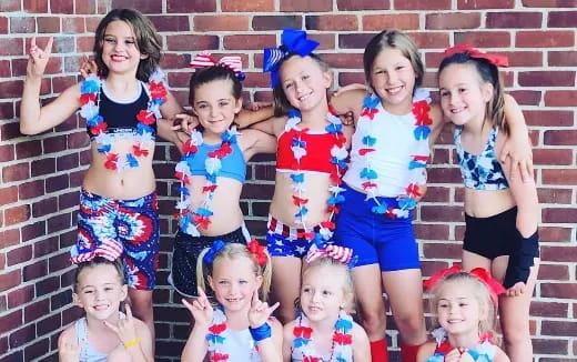 a group of girls posing for a photo