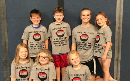 a group of children posing for a photo