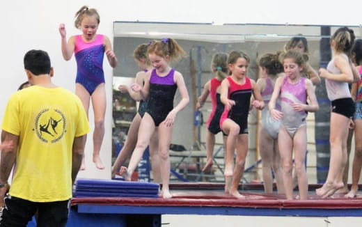 a group of people in a gym