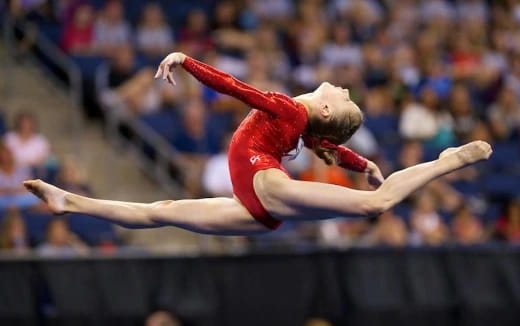 a person performing a gymnastics trick