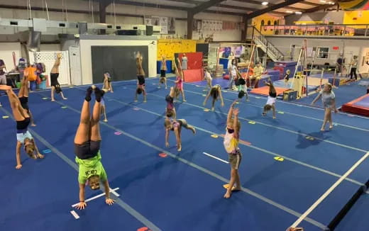 a group of people playing volleyball