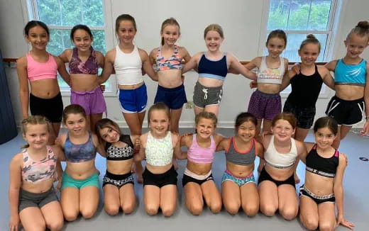 a group of girls posing for a photo