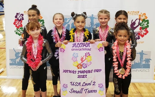 a group of children holding a sign