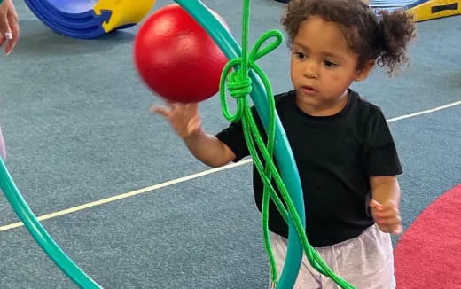 a child holding a balloon